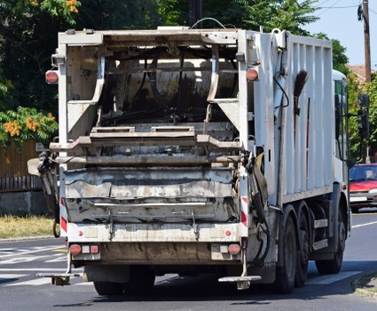 Workers wearing PPE while sorting commercial waste